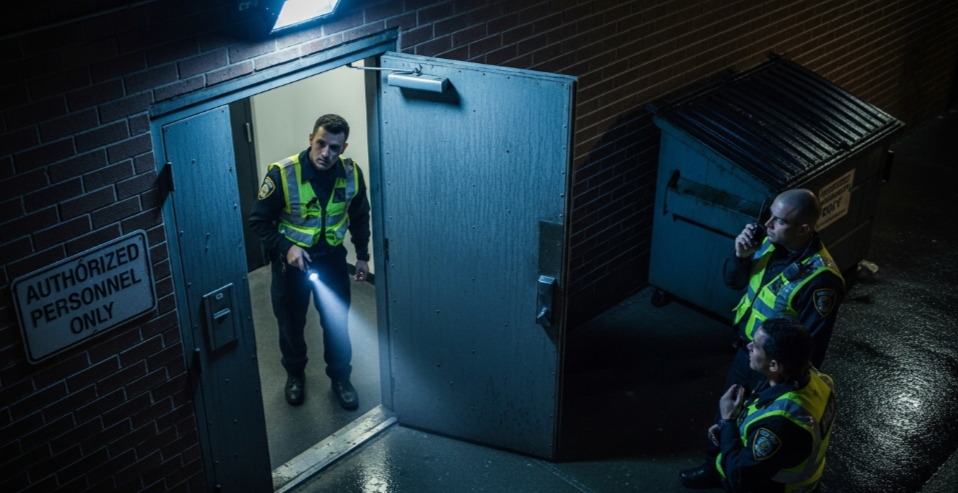 Office Building Security Guards Preventing After-Hours Break-Ins at Side Doors